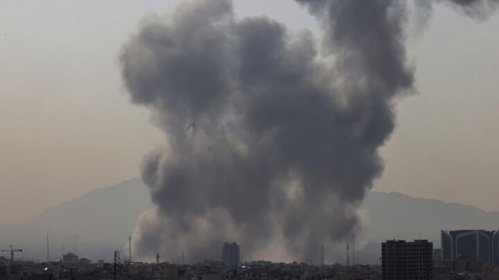 A plume of smoke rises following a reported explosion in Tehran on February 28, 2026