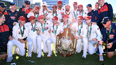 South Australia's players celebrate after beating Victoria to win the Sheffield Shield final