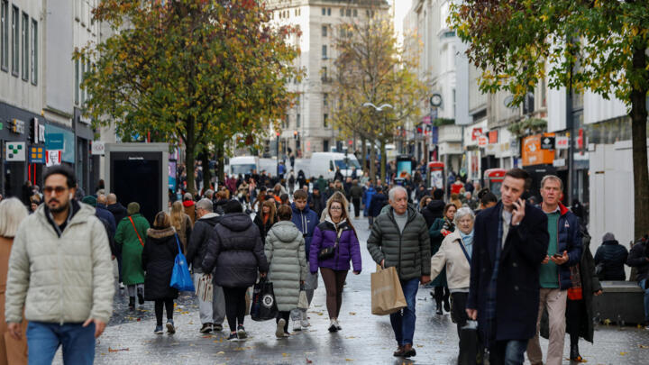 People walk through the city centre in Liverpool, Britain November 27, 2025. 