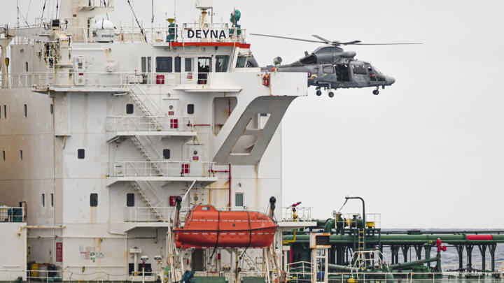 A French Navy helicopter hovers over the Deyna vessel, accused of belonging to Russia's "shadow fleet", during an operation in the Western Mediterranean Sea, on March 20, 2026.