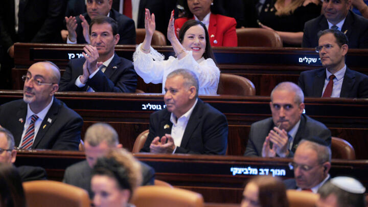 Members of the Knesset applaud as President Donald Trump addresses the body, Israel's parliament, Oct. 13, 2025, Jerusalem