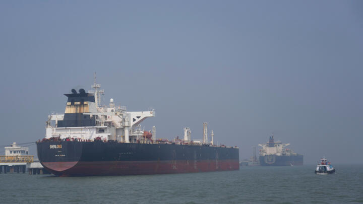 Liberia-flagged tanker Shenlong Suezmax, carrying crude oil from Saudi Arabia, that arrived clearing the Strait of Hormuz, is seen at the Mumbai Port in Mumbai, India, on March 12, 2026.