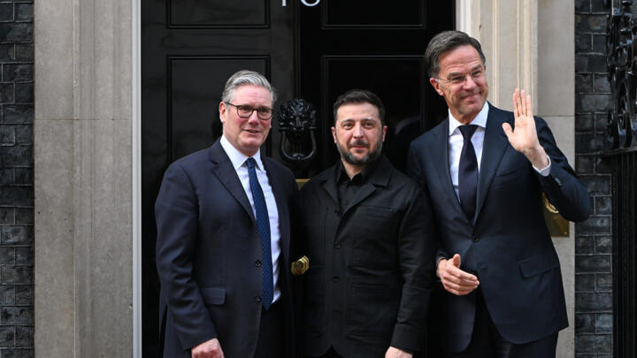 British Prime Minister Keir Starmer, Ukrainian President Volodymyr Zelenskyy and NATO Secretary-General Mark Rutte leave 10 Downing Street after a meeting in London on March 17, 2026.