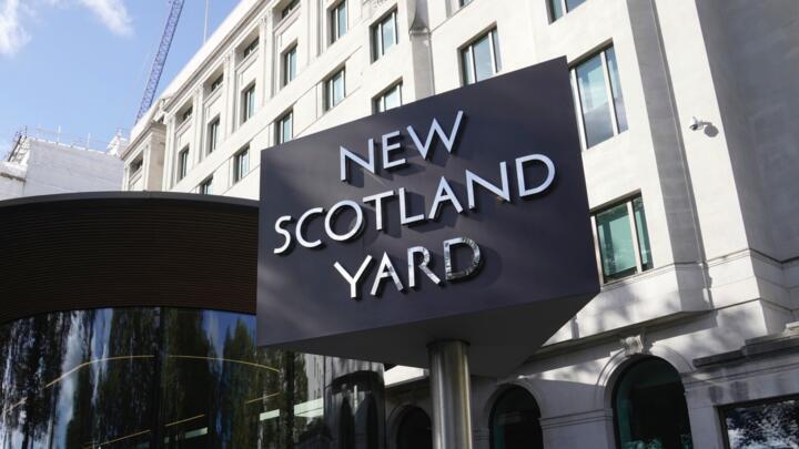 A sign stands in front of the New Scotland Yard, the headquarters of the London Metropolitan Police, in London, on September 25, 2023.