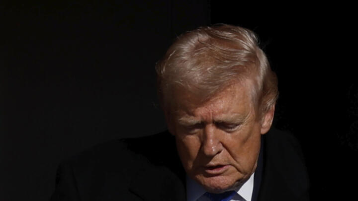 President Donald Trump disembarks Air Force One upon his arrival at Joint Base Andrews, Md., Monday, March 23, 2026.