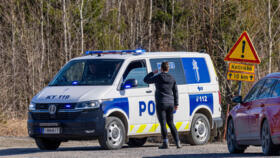 A Police car blocks the Savistontie road after two unidentified drones entered and landed in Finnish territory, in Kouvola, Finland, Sunday, March 29, 2026