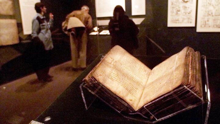 The Archimedes Palimpsest sits under plexiglass Wednesday, Nov. 3, 1999, at the Field Museum in Chicago. The palimpsest contains the mathematical treatises of Archimedes.