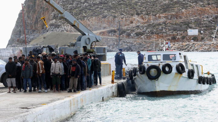 In this file photo, migrants disembark from a boat at a port in Heraklion, southern Crete, on February 21, 2026