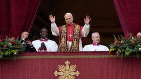 Pope Leo XIV waves after delivering the Urbi et Orbi (Latin for 'To the city and to the world' ) Christmas Day blessing from the main balcony of St. Peter's Basilica at the Vatican