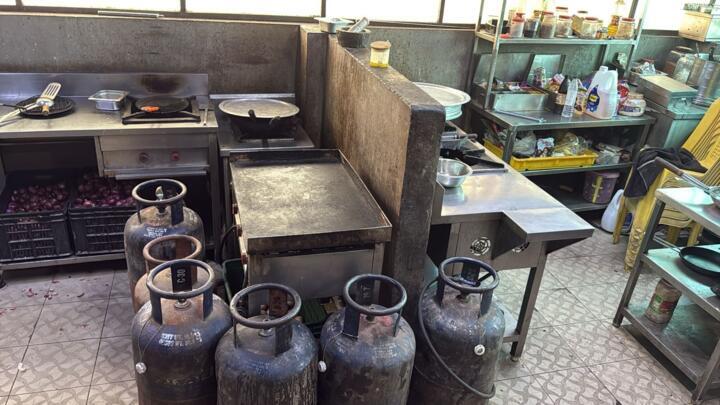 Empty cooking gas canisters in the kitchen of the Spicy Dine Inn restaurant in Gujarat state. Since the US and Israel attacked Iran on February 28, 2026, Indian restaurants have been experiencing a shortage of cooking gas.