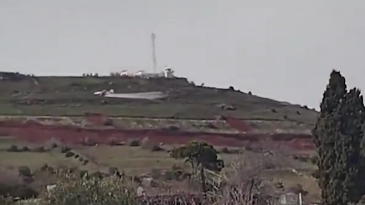 An Israeli plane at low altitude spraying herbicides on farmland near Quneitra, Syria.