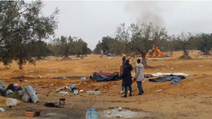 Migrants amid the remains of tents near Sfax, Tunisia, in January 2026